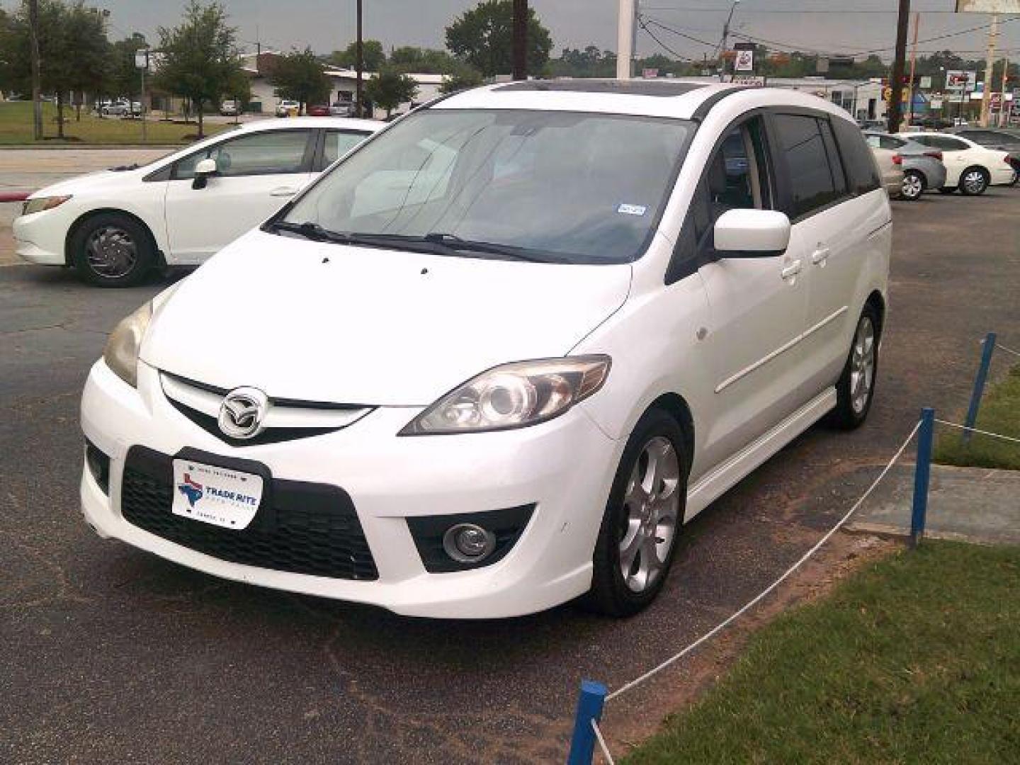 2009 Crystal White Pearl Mazda MAZDA5 Sport (JM1CR293590) with an 2.3L L4 DOHC 16V engine, located at 116 N. Frazier Street, Conroe, TX, 77301, (936) 647-0690, 30.308662, -95.460480 - Photo#2