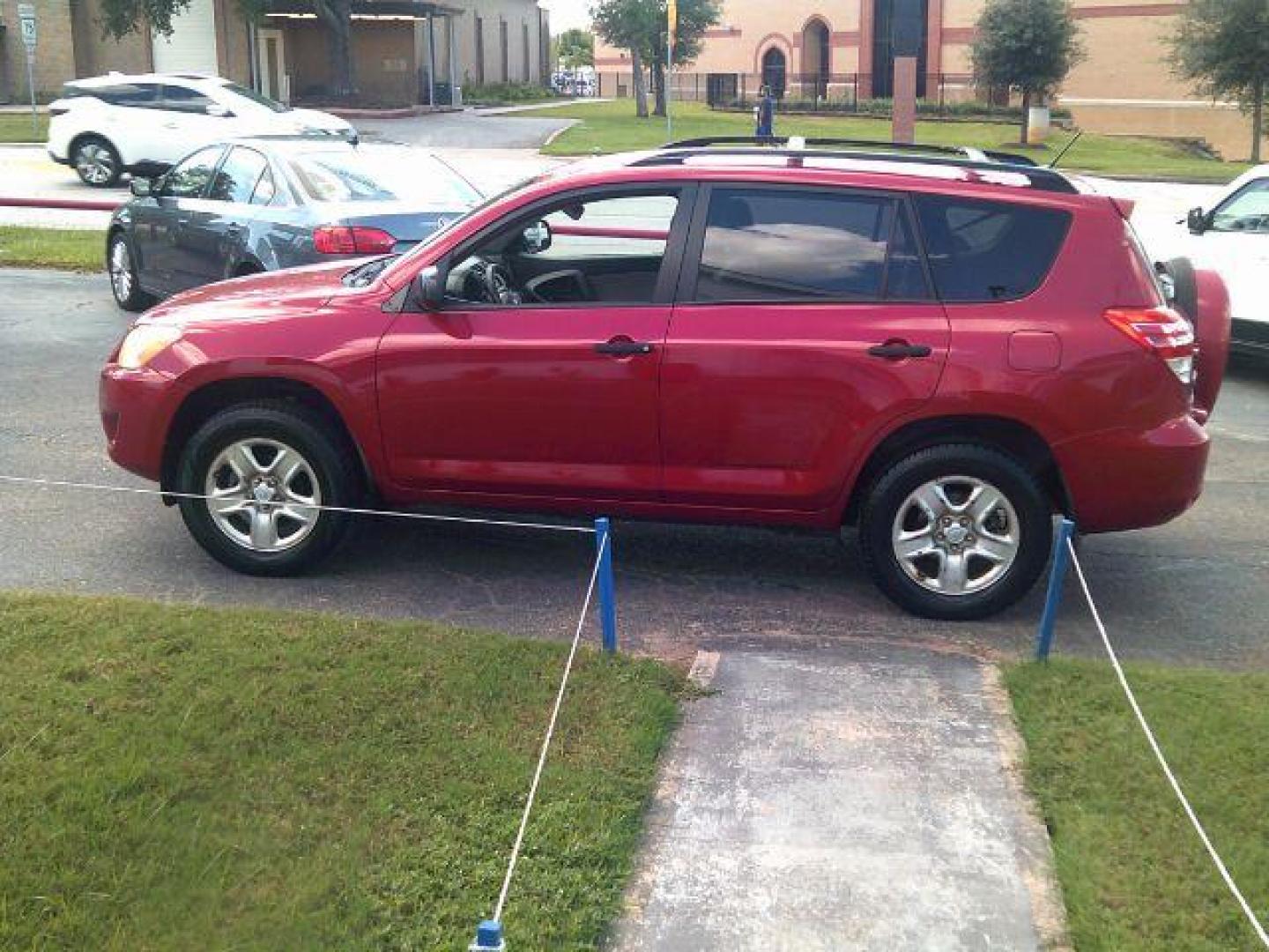 2010 Barcelona Red Metall /Ash Cloth Interior Toyota RAV4 Base I4 2WD (JTMZF4DV8AD) with an 2.4L L4 DOHC 16V engine, 4-Speed Automatic transmission, located at 116 N. Frazier Street, Conroe, TX, 77301, (936) 647-0690, 30.308662, -95.460480 - Photo#3