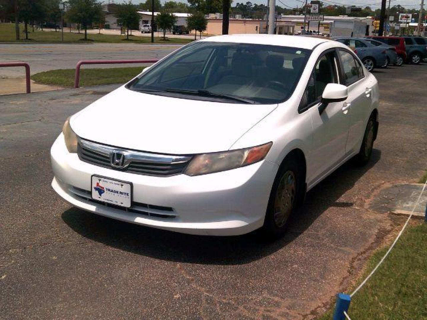 2012 Taffeta White /Stone Honda Civic LX (2HGFB2F5XCH) with an 1.8L I-4 i-VTEC variable valve control engine, 5-Speed Automatic transmission, located at 116 N. Frazier Street, Conroe, TX, 77301, (936) 647-0690, 30.308662, -95.460480 - Photo#2