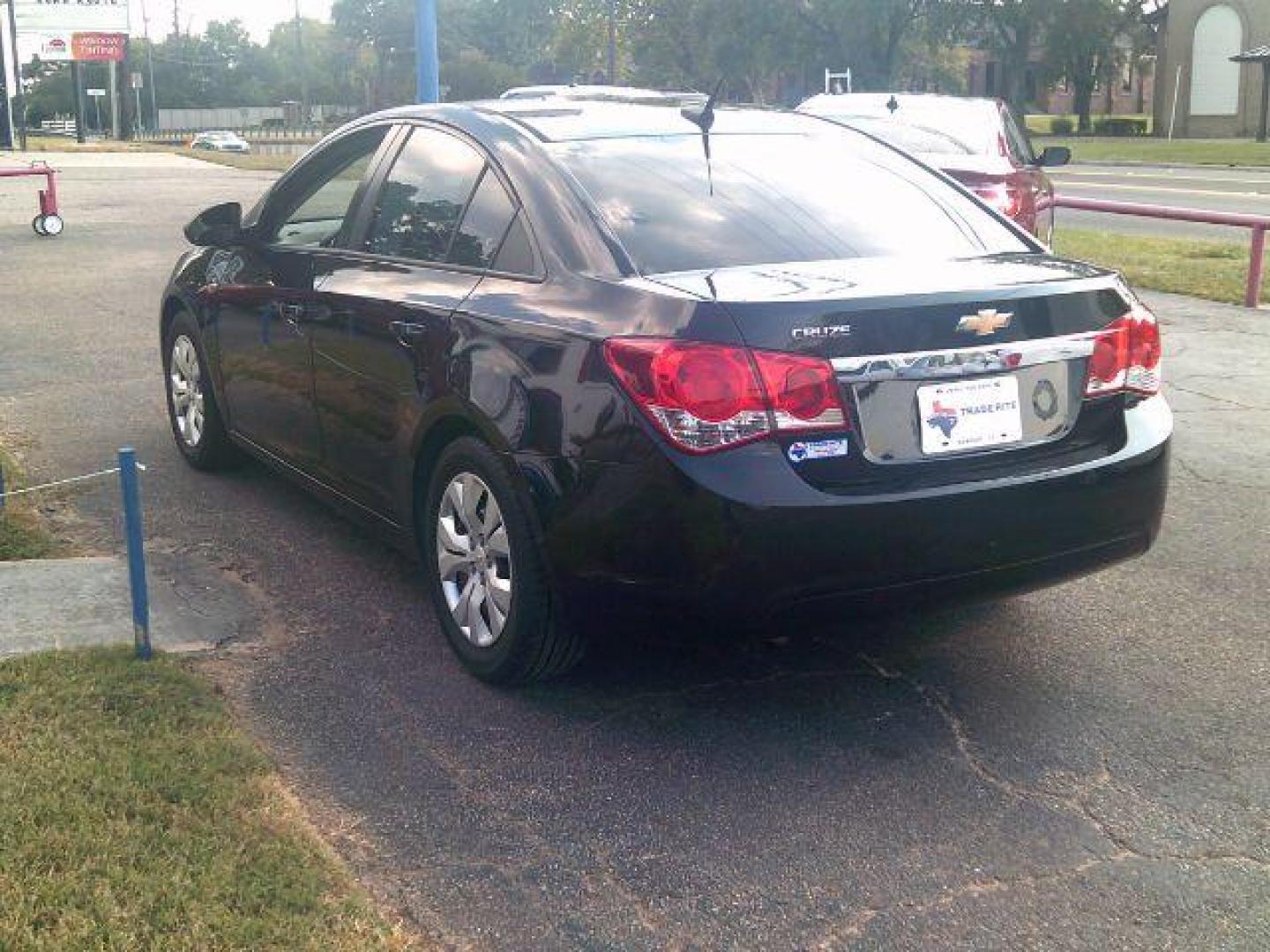 2014 BLACK Chevrolet Cruze LS Auto (1G1PA5SH0E7) with an ECOTEC 1.8L I-4 DOHC engine, located at 116 N. Frazier Street, Conroe, TX, 77301, (936) 647-0690, 30.308662, -95.460480 - Photo#4