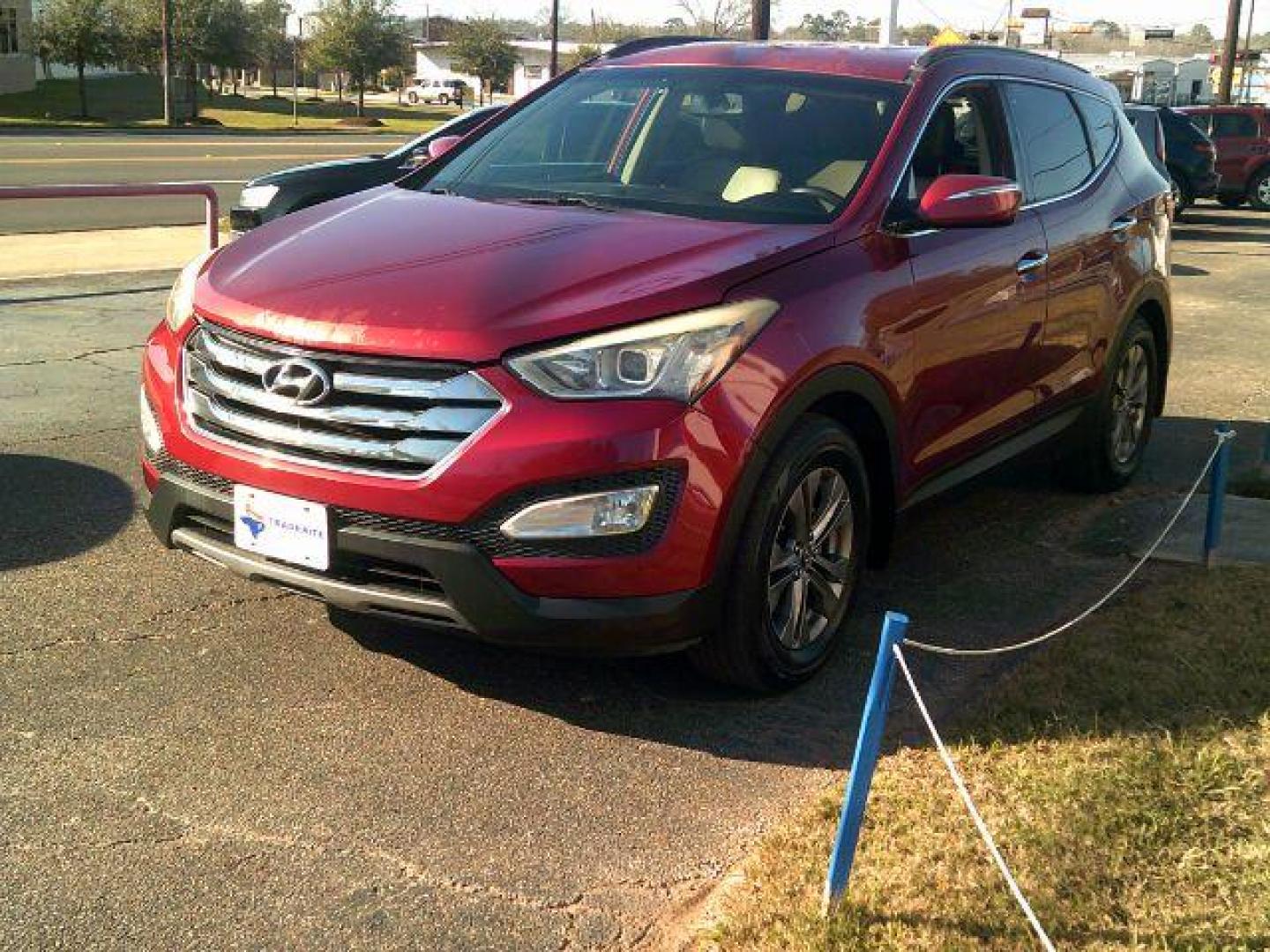 2014 Serrano Red /Beige Hyundai Santa Fe Sport 2.4L (5XYZU3LB9EG) with an Theta II 2.4L I-4 gasoline direct injection engine, 5-Speed Automatic transmission, located at 116 N. Frazier Street, Conroe, TX, 77301, (936) 647-0690, 30.308662, -95.460480 - Photo#2