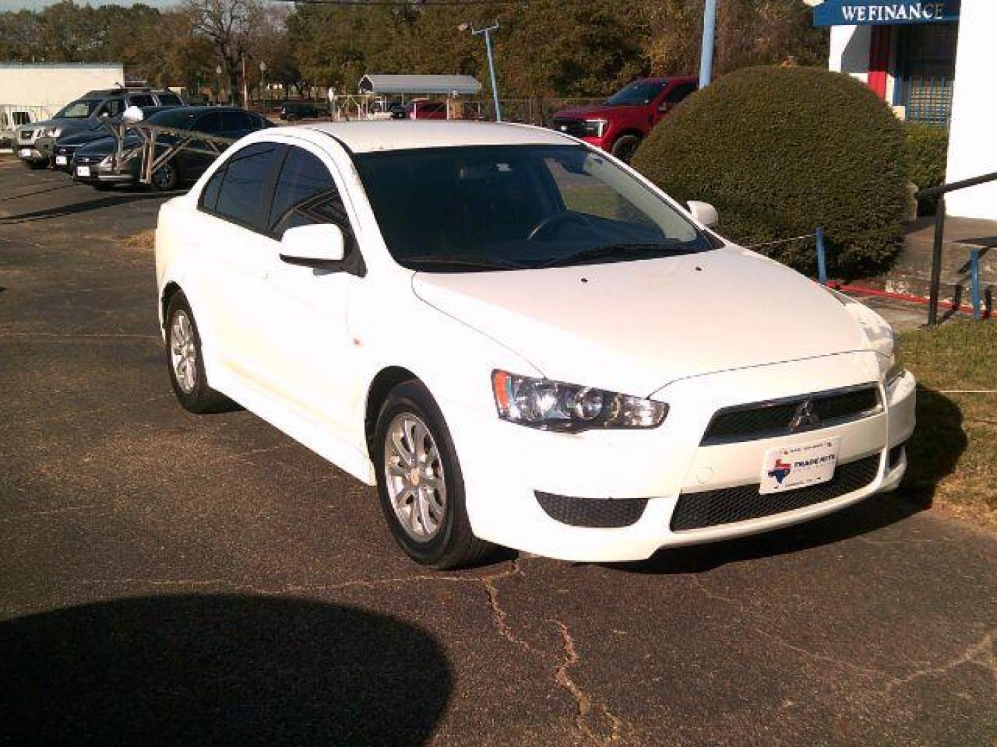 2014 Wicked White Metallic /Black Mitsubishi Lancer ES (JA32U2FUXEU) with an 2L I-4 DOHC engine, 5-Speed Automatic transmission, located at 116 N. Frazier Street, Conroe, TX, 77301, (936) 647-0690, 30.308662, -95.460480 - Photo#1