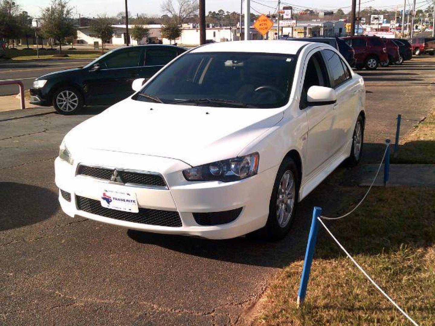 2014 Wicked White Metallic /Black Mitsubishi Lancer ES (JA32U2FUXEU) with an 2L I-4 DOHC engine, 5-Speed Automatic transmission, located at 116 N. Frazier Street, Conroe, TX, 77301, (936) 647-0690, 30.308662, -95.460480 - Photo#2