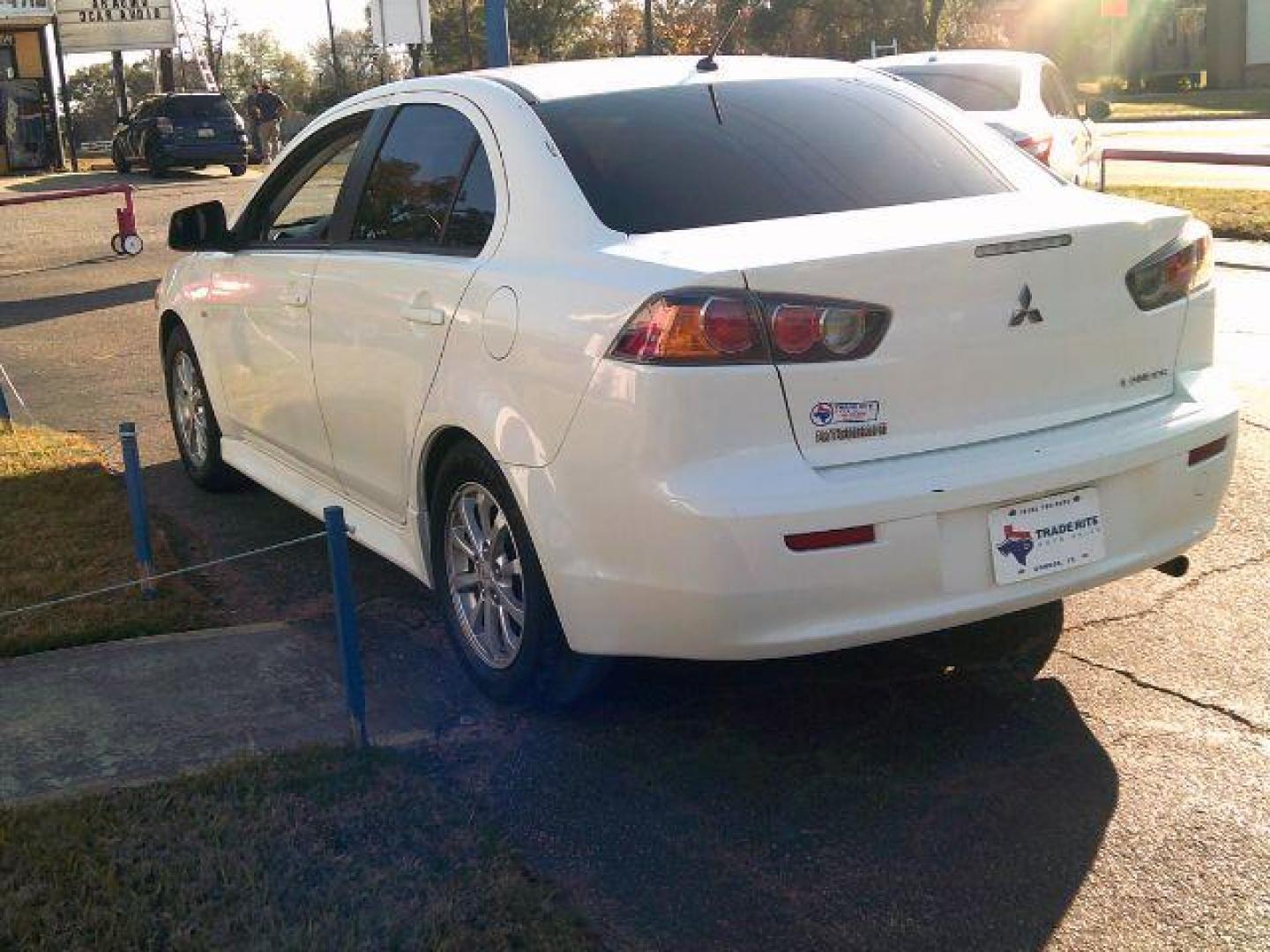 2014 Wicked White Metallic /Black Mitsubishi Lancer ES (JA32U2FUXEU) with an 2L I-4 DOHC engine, 5-Speed Automatic transmission, located at 116 N. Frazier Street, Conroe, TX, 77301, (936) 647-0690, 30.308662, -95.460480 - Photo#4