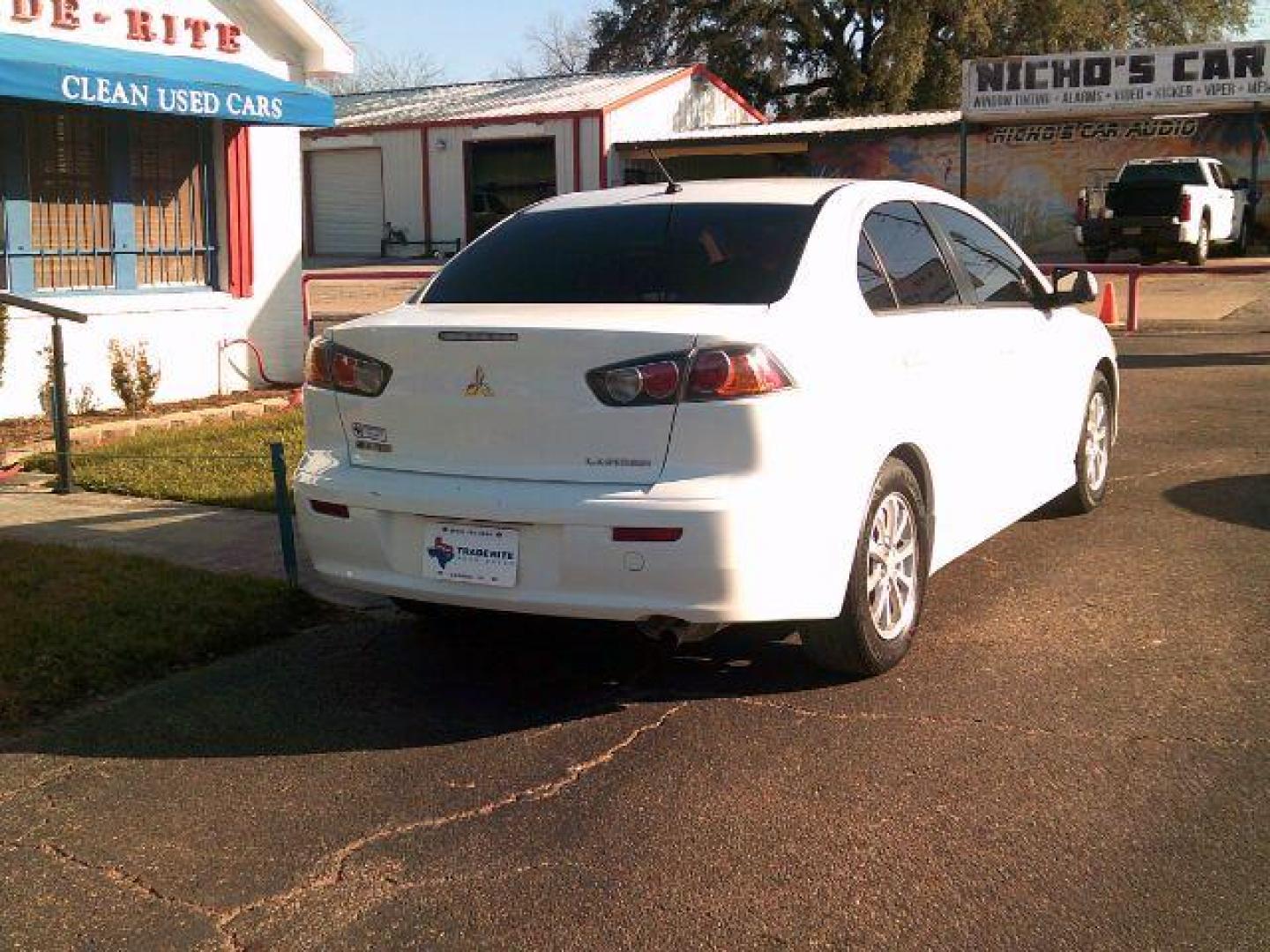 2014 Wicked White Metallic /Black Mitsubishi Lancer ES (JA32U2FUXEU) with an 2L I-4 DOHC engine, 5-Speed Automatic transmission, located at 116 N. Frazier Street, Conroe, TX, 77301, (936) 647-0690, 30.308662, -95.460480 - Photo#5
