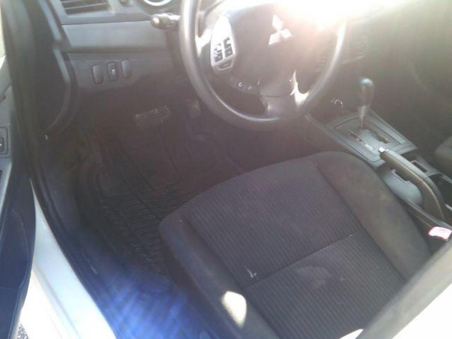 2014 Wicked White Metallic /Black Mitsubishi Lancer ES (JA32U2FUXEU) with an 2L I-4 DOHC engine, 5-Speed Automatic transmission, located at 116 N. Frazier Street, Conroe, TX, 77301, (936) 647-0690, 30.308662, -95.460480 - Photo#7