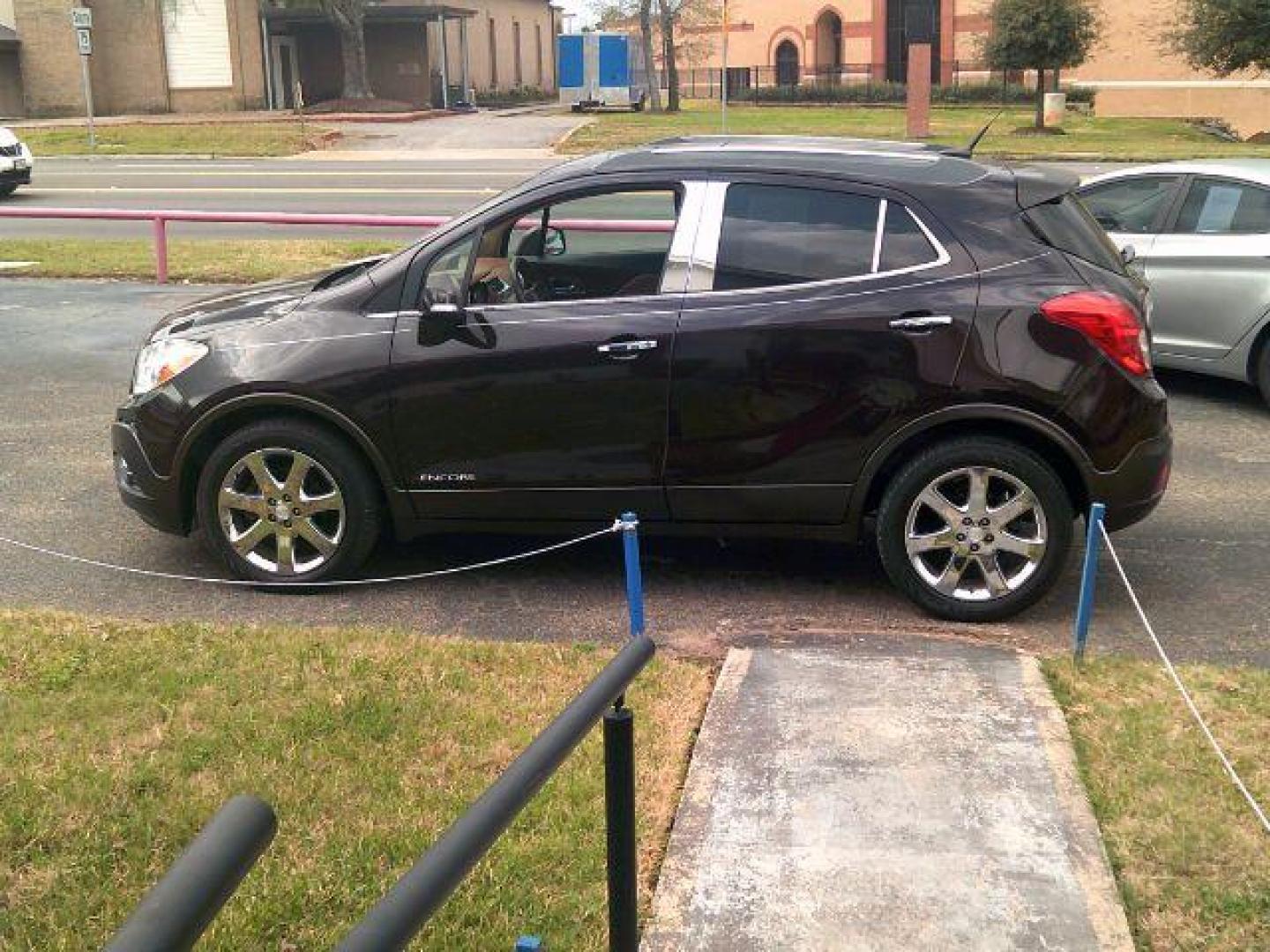 2014 Deep Espresso Brown Metallic /Saddle Buick Encore Leather (KL4CJCSB0EB) with an Ecotec 1.4L I-4 DOHC engine, located at 116 N. Frazier Street, Conroe, TX, 77301, (936) 647-0690, 30.308662, -95.460480 - Photo#3