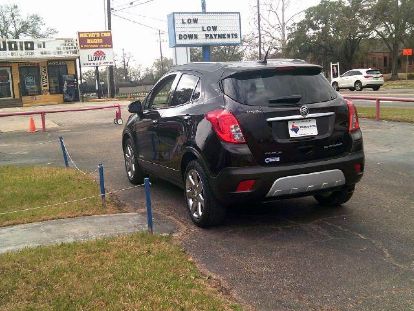2014 Deep Espresso Brown Metallic /Saddle Buick Encore Leather (KL4CJCSB0EB) with an Ecotec 1.4L I-4 DOHC engine, located at 116 N. Frazier Street, Conroe, TX, 77301, (936) 647-0690, 30.308662, -95.460480 - Photo#4