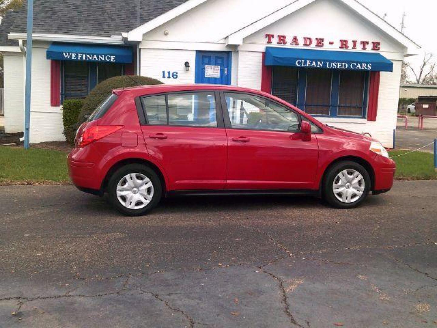 2012 Red Alert Metallic /Charcoal Nissan Versa 1.8 S (3N1BC1CP8CL) with an 1.8L I-4 DOHC engine, 5-Speed Automatic transmission, located at 116 N. Frazier Street, Conroe, TX, 77301, (936) 647-0690, 30.308662, -95.460480 - Photo#0