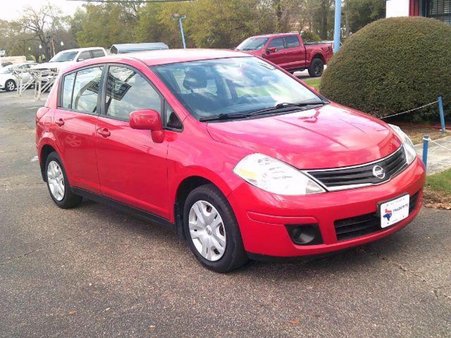 2012 Red Alert Metallic /Charcoal Nissan Versa 1.8 S (3N1BC1CP8CL) with an 1.8L I-4 DOHC engine, 5-Speed Automatic transmission, located at 116 N. Frazier Street, Conroe, TX, 77301, (936) 647-0690, 30.308662, -95.460480 - Photo#1