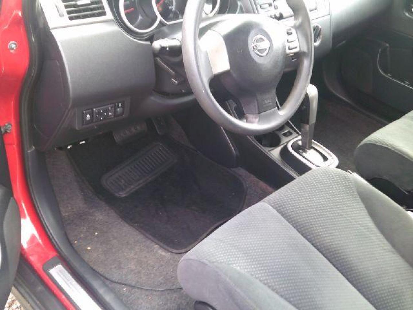 2012 Red Alert Metallic /Charcoal Nissan Versa 1.8 S (3N1BC1CP8CL) with an 1.8L I-4 DOHC engine, 5-Speed Automatic transmission, located at 116 N. Frazier Street, Conroe, TX, 77301, (936) 647-0690, 30.308662, -95.460480 - Photo#7