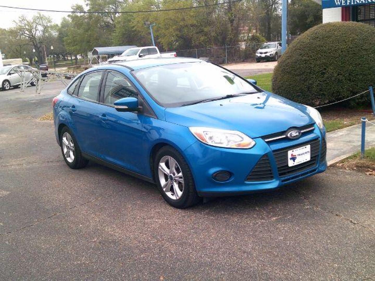 2014 Blue Candy Tinted Clearcoat /Charcoal Black Ford Focus SE (1FADP3F2XEL) with an 2L I-4 gasoline direct injection engine, 5-Speed Automatic transmission, located at 116 N. Frazier Street, Conroe, TX, 77301, (936) 647-0690, 30.308662, -95.460480 - Photo#1